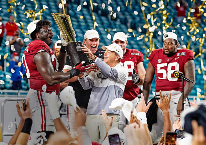 Nick Saban lifts the 2020 championship trophy for Alabama